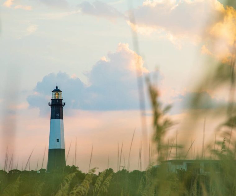 A lighthouse at sunset on Tybee Island, Georgia. The island is located in Chatham County, where the Smart Sea Level Sensors program is being implemented. Credit: Impact Media Lab / AAAS