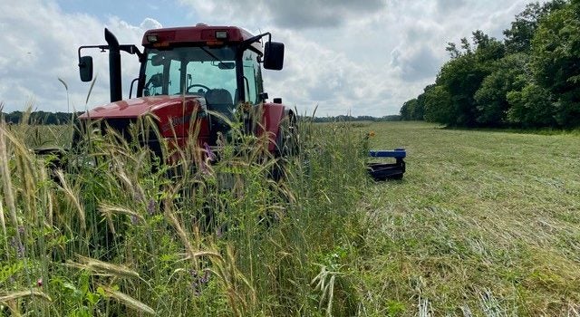 Picture of tractor. Mac Kincaid has seen vast improvements on his farm since he started using cover crops